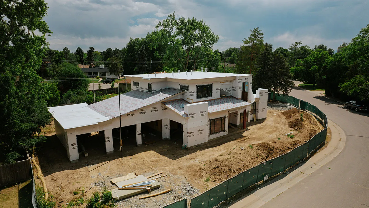 Aerial view of a large custom home under construction
